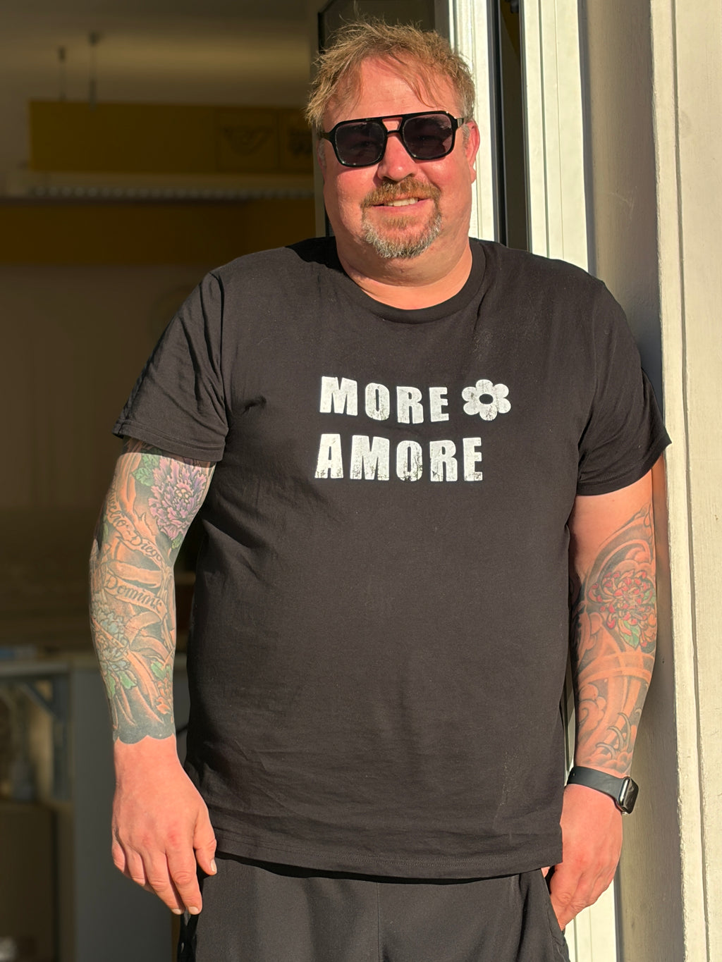 MARKUS – MORE AMORE Unisex T-Shirt – Black/Raw White