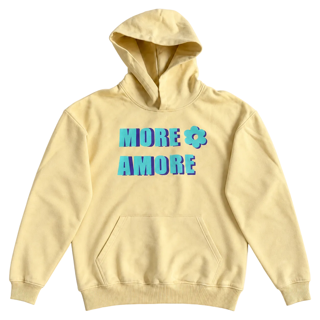 MORE AMORE Boxy Unisex-Hoodie in Soft Yellow mit türkisem Print und violettem Schatten – Vorderansicht