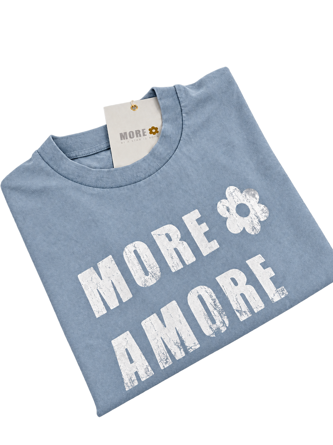 MORE AMORE Vintage Light Blue Cropped T-Shirt – gefaltete Vorderansicht aus schräger Perspektive